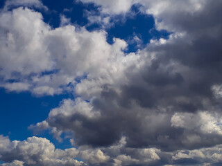 Fototapeta na wymiar Heavy gray rain clouds in the blue sky. Atmosphere, air, cloudy, soon rain.