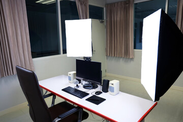 Desktop computer for online class education at school or university. Computer set for online learning with microphone, webcam, speaker and pen tablet. Studio light in online classroom.