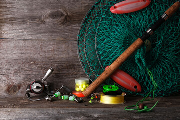 Fishing tackle on  wooden vintage background with copy space