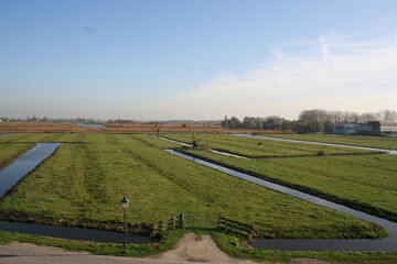 Polder landscape in the Netherlands with mills.