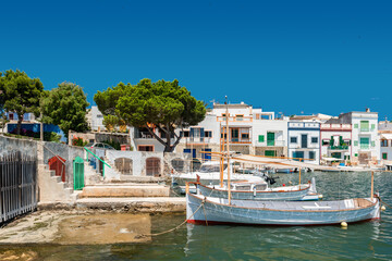 Fototapeta na wymiar Mallorca | Boats at traditional boat houses - Barraques - in the historic port of Portocolom