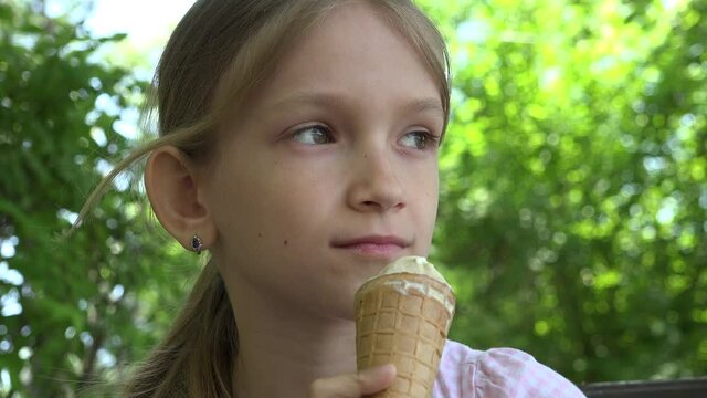 Kid Eating Ice Cream at Playground, Child Portrait Outdoor in Nature, Girl Relaxing Sitting on Bench in Park