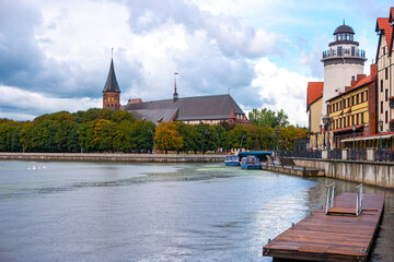 Obraz premium View of Koenigsberg cathedral on Kant island or Kneiphof island and the Fishing Village. Kaliningrad in the fall during the rain.