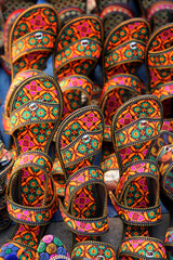 Indian traditional slippers for women. jaipur, Rajasthan India, March 2018. handmade Traditional Indian slippers. Colorful footwear. rajasthani slippers at a street market.