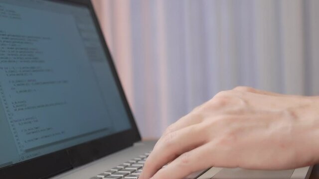 The Process Of Writing Software Code By A Web Developer. The Web Programmer Debugs The Program.