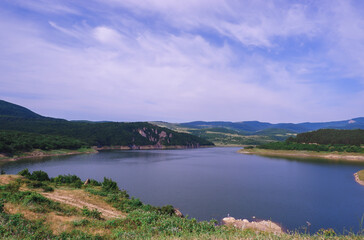 Clear blue lake and mountains around