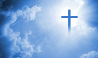Christian cross appeared bright in the sky with soft fluffy clouds, white, beautiful colors. With...