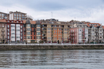 Houses with colored facades at the mouth of the Ria de Bilbao in Portugalete, Biscay, Basque Country, Spain, Europe.