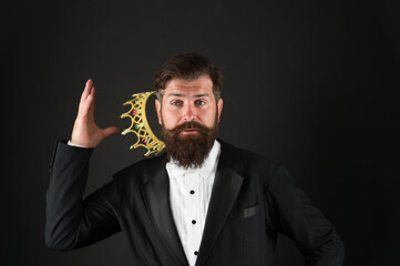 higher standard. bearded man in golden crown. elegant man in formal wear at special event. Party...