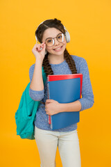 Teen with backpack. Cute smiling schoolgirl. Girl little schoolgirl carry backpack. Pupil going to school. Modern schoolgirl daily life. School club. School system functions. Private schooling - obrazy, fototapety, plakaty