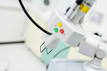modern device for skin rejuvenation-fractional laser close-up on the background of a cosmetology...