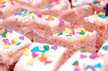 Small sliced cakes with tiny bits of shapes