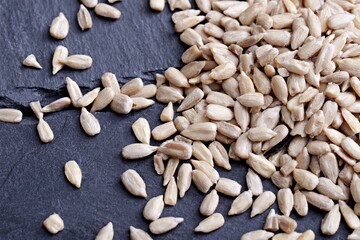 sunflower seeds on wooden background