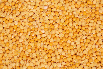 Yellow chopped peas. Legumes background.