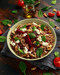 Buckwheat and beetroot salad with mushroom, walnut, spinach and feta cheese. healthy diet food