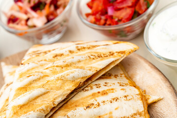 Mexican homemade quesadilla pulled pork with tomato salad  guacamole