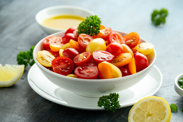 Healthy Tomato cherry salad in white bowl