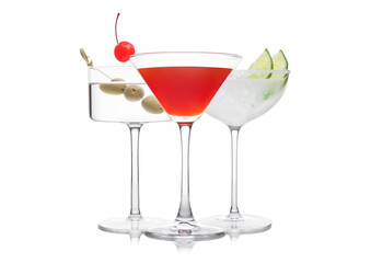 Cosmopolitan, Vodka Martini and Margarita cocktails in classic crystal glasses with pink cherry, limes and olives on white.