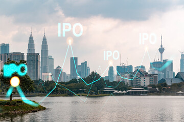 Hologram of IPO glowing icon, sunset panoramic city view of Kuala Lumpur. KL is the financial hub...