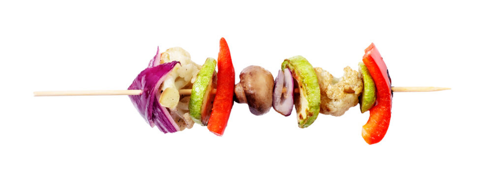 Vagan skewers of vegetables on a skewer on a white isolated background.