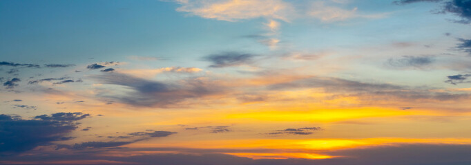 Panorama of dramatic sky with picturesque clouds during sunset