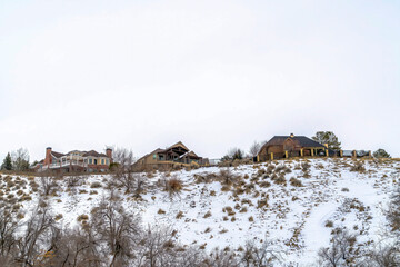 Beautiful houses on a snow dusted mountain in Salt Lake City viewed in winter