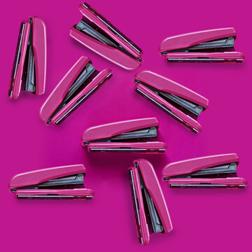 bright pink stapler on a bright background pattern