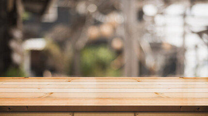 Empty wooden table top with lights bokeh on blur restaurant background. You can mock up your product