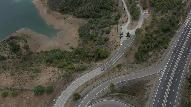 Aerial drone view of Odeleite Dam reservoir in Algarve, Portugal. Landscape reveal