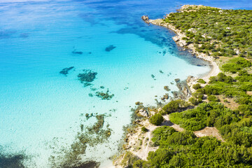 Fototapeta na wymiar View from above, stunning aerial view of a rocky coastline bathed by a beautiful turquoise sea. Cala Sabina, Costa Smeralda, Sardinia, Italy.