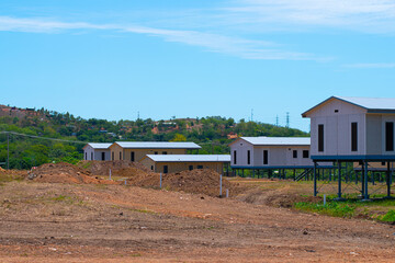 Obraz premium Papua New Guinea, Port Moresby, 7 Mile Kennedy Estate. Chinese builders manufacture new houses, fast building construction. New houses for local community, Chinese project. 