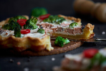French traditional quiche Lorraine pie with broccoli and salmon