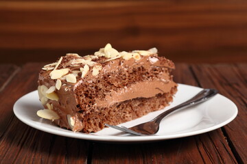 Chocolate sandwich cake garnished with flaked almonds