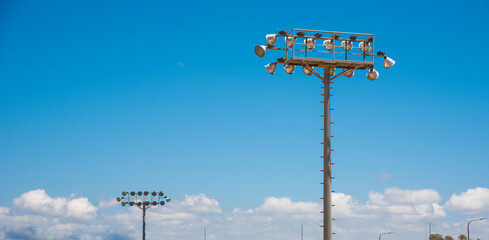 stadium lighting mast against blue sky