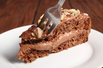 Chocolate sandwich cake garnished with flaked almonds