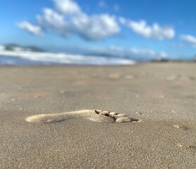 Sand footprint. Beach background.