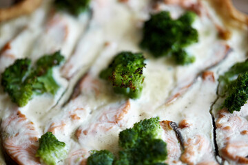 French traditional quiche Lorraine pie with broccoli and salmon