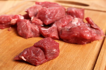 Diced beef casserole steak on cutting board