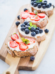Fresh dietetic sandwiches with cheese and fruit