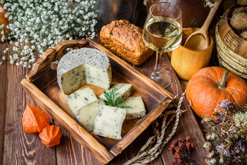 Delicate moldy cheese slices on a plate ready for breakfast