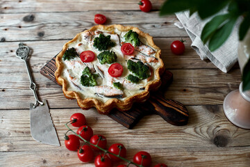 French traditional quiche Lorraine pie with broccoli and salmon