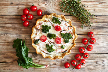 French traditional quiche Lorraine pie with broccoli and salmon