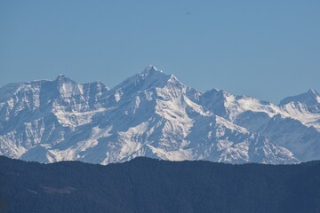 Fototapeta na wymiar snow covered himalayan mountain peaks in winter