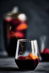 Delicious refreshing sangria. Spanish national drink with oranges, strawberries and ice. Home made production..