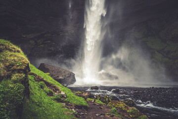 Waterfall Kvernufoss in the mountains 2