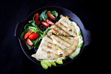 Chicken Quesadilla with avocado, dried tomatoes and jalapeno