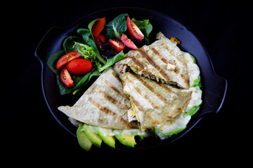 Chicken Quesadilla with avocado, dried tomatoes and jalapeno