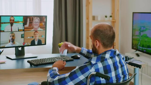 Entrepreneur in wheelchair communicating online with business partners. Handicapped invalid paralysed freelancer, immobilized entrepreneur working from home, ilness and disability