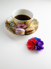 Close up from fresh macaron and black coffee