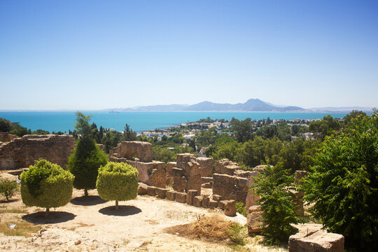 Ancient ruins at Carthage, Tunisia with the Mediterranean Sea. View from hill Byrsa with ancient remains of Carthage and landscape. Tunis, Tunisia.